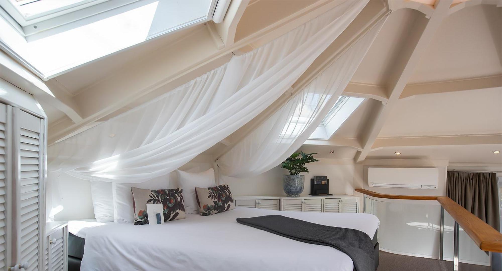Boutique Hotel Texel De Cocksdorp  Rom bilde A bedroom in the hotel